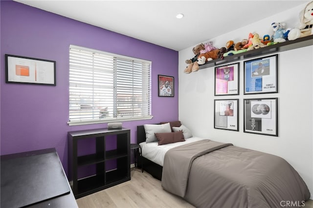 bedroom featuring light wood-style floors