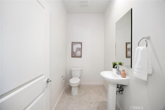 bathroom with visible vents, baseboards, toilet, and tile patterned flooring