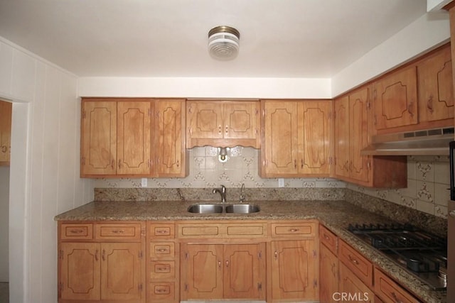 1111 Taos Dr, Barstow, CA 92311 - kitchen with a sink, under cabinet range hood, stainless steel gas cooktop, and backsplash