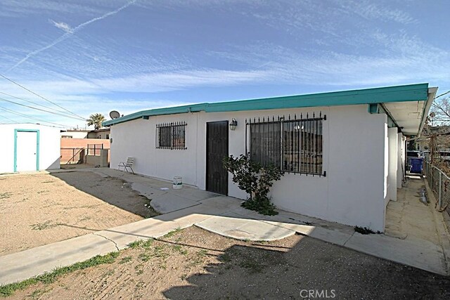 1111 Taos Dr, Barstow, CA 92311 - view of front facade with a gate