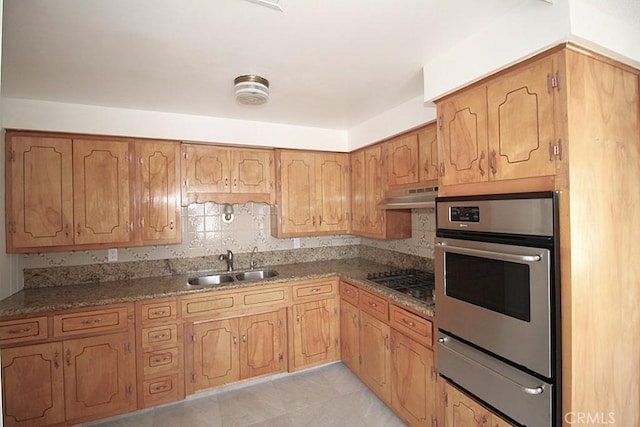 1111 Taos Dr, Barstow, CA 92311 - kitchen featuring oven, a warming drawer, a sink, black cooktop, and under cabinet range hood