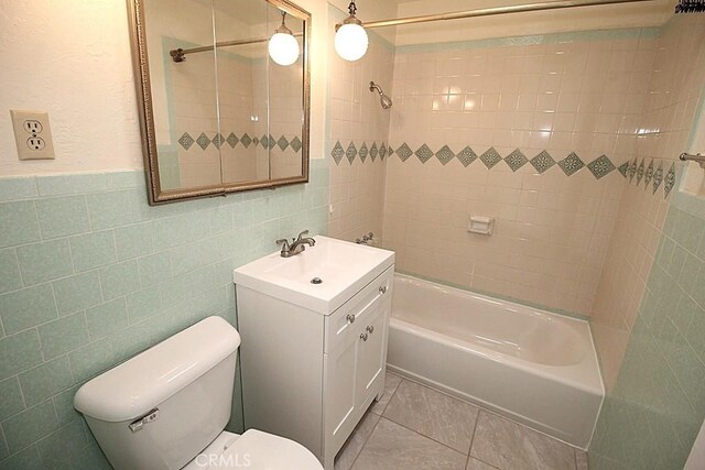 1111 Taos Dr, Barstow, CA 92311 - bathroom featuring toilet, shower / bathtub combination, vanity, tile walls, and tile patterned floors