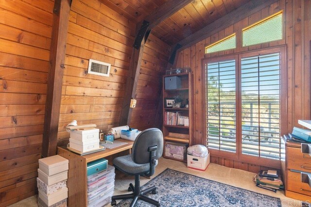 home office featuring lofted ceiling with beams, visible vents, wooden walls, and wood ceiling