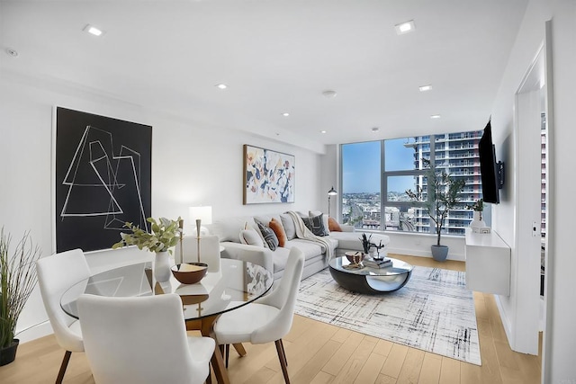 dining room featuring recessed lighting and light wood-style flooring