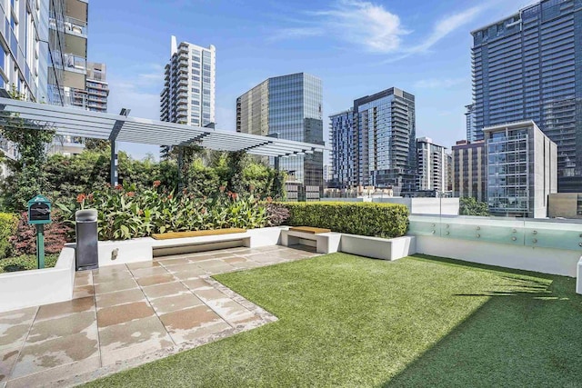 view of yard featuring a patio and a city view