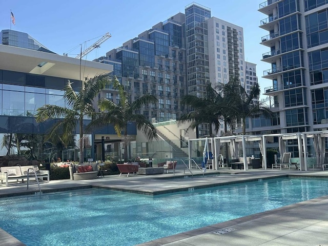 pool with a city view and a patio area
