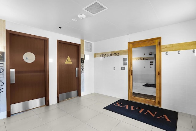interior space with elevator and visible vents