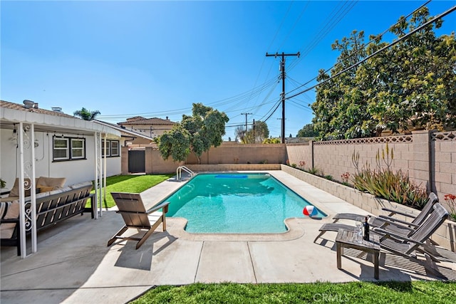 view of pool with a patio area, a fenced in pool, and a fenced backyard