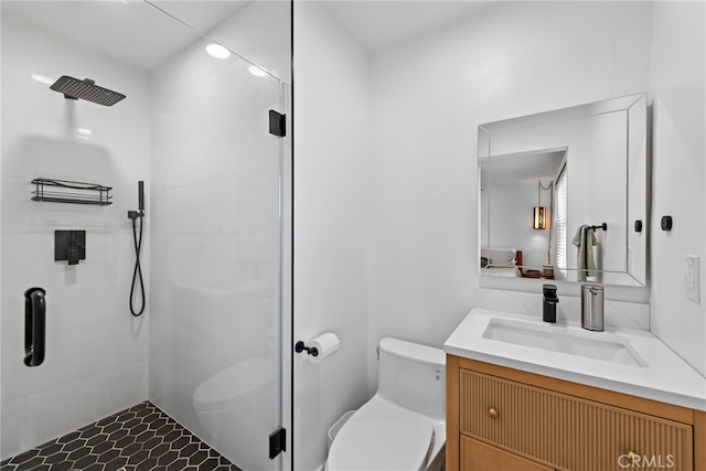 full bath with vanity, toilet, and a shower stall