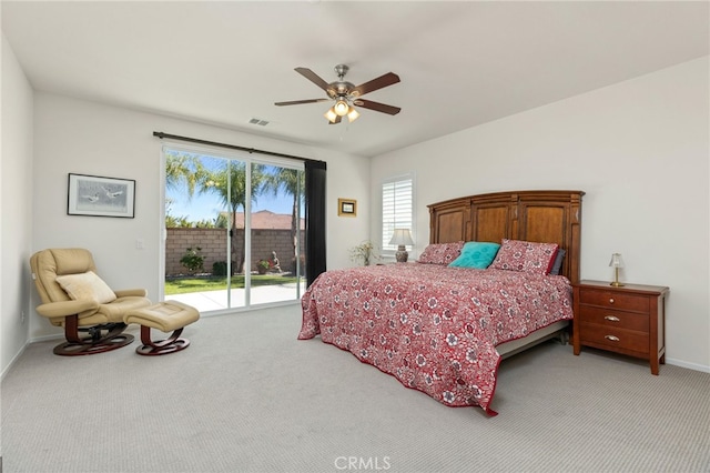 bedroom featuring visible vents, light carpet, a ceiling fan, access to outside, and baseboards