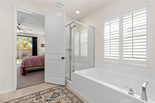 ensuite bathroom featuring tile patterned floors, ensuite bath, a shower stall, and a bath