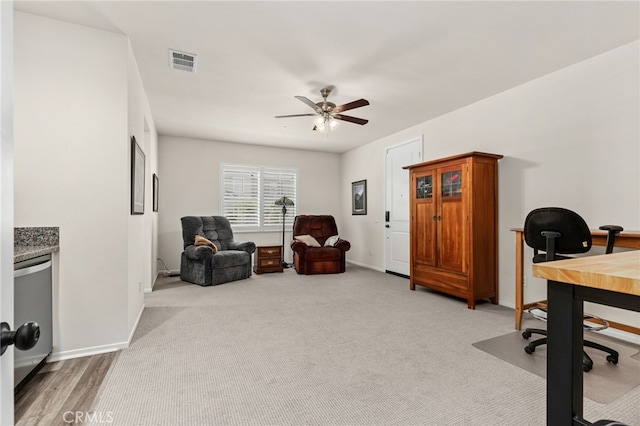 office with light colored carpet, baseboards, visible vents, and a ceiling fan