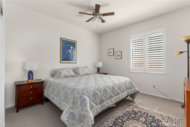 bedroom with ceiling fan, baseboards, and carpet