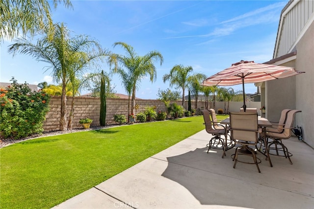 view of patio / terrace with outdoor dining space and a fenced backyard