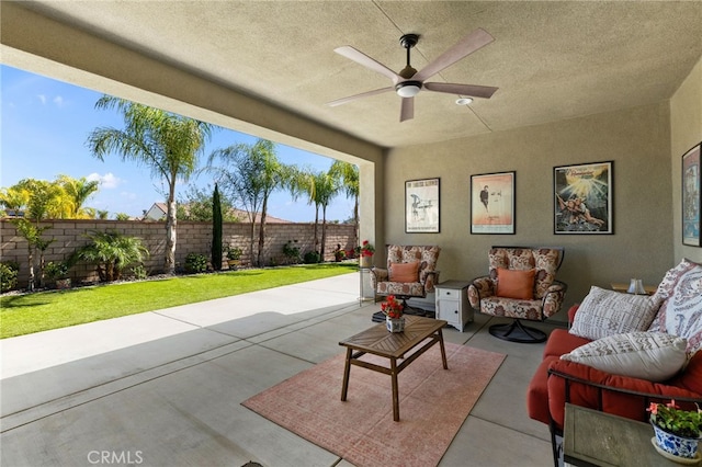 view of patio / terrace with an outdoor hangout area, a ceiling fan, and fence