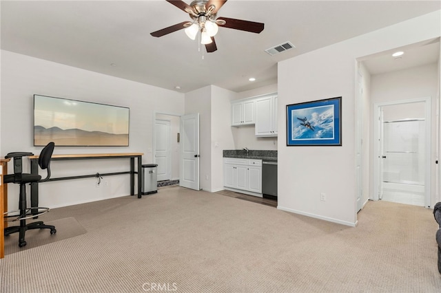 interior space featuring recessed lighting, light colored carpet, visible vents, and baseboards