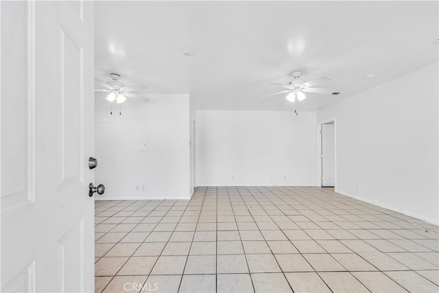 unfurnished room with baseboards and ceiling fan