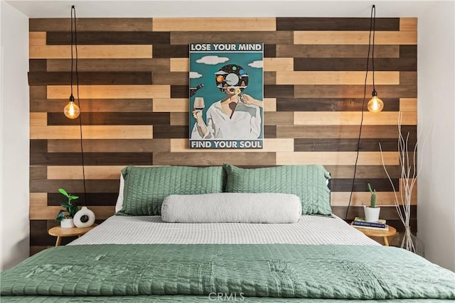 bedroom with wood walls