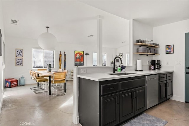 kitchen featuring stainless steel dishwasher, finished concrete flooring, visible vents, and a sink