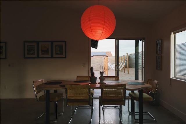 dining room with a wealth of natural light and baseboards