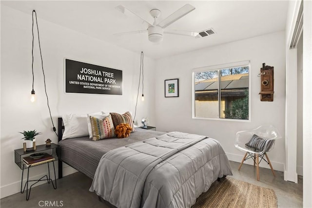 bedroom featuring visible vents, a ceiling fan, concrete floors, and baseboards