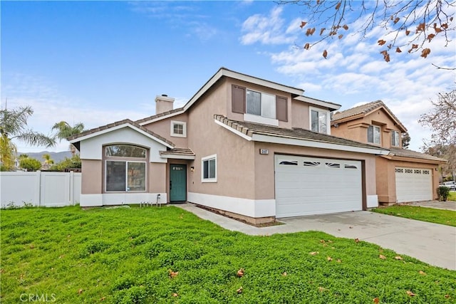 traditional home featuring fence, driveway, stucco siding, a front lawn, and a garage