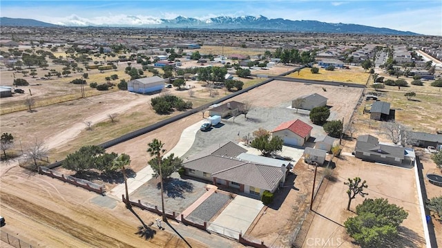 birds eye view of property with a mountain view