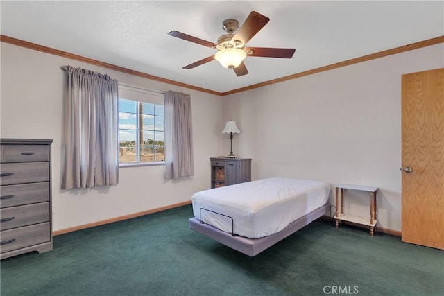 bedroom featuring carpet flooring, a ceiling fan, baseboards, and ornamental molding