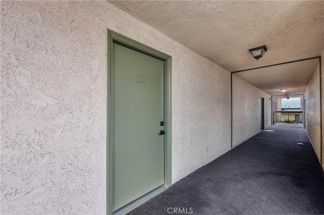 property entrance featuring stucco siding