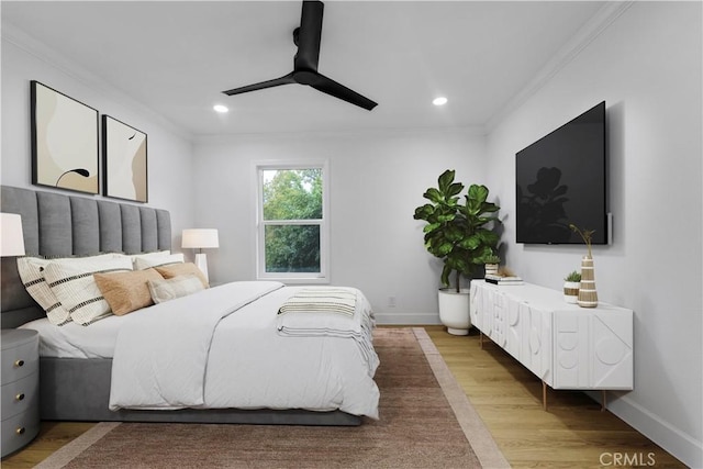 bedroom with recessed lighting, baseboards, light wood-style floors, and ornamental molding