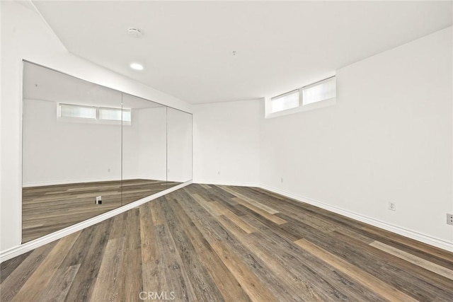 basement with wood finished floors and baseboards