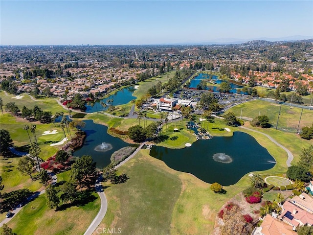 bird's eye view with a water view and golf course view