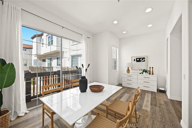 dining room with recessed lighting, baseboards, and wood finished floors