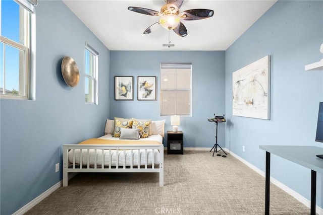 bedroom with baseboards, carpet, and a ceiling fan