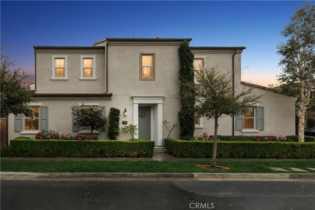 view of front of house featuring stucco siding