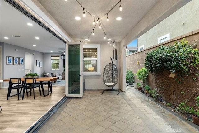 view of patio / terrace with visible vents, outdoor dining space, and fence