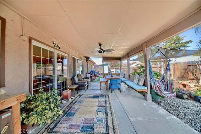 view of patio with a ceiling fan, a fenced backyard, and outdoor lounge area