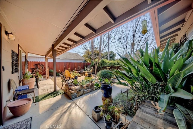 view of patio featuring fence