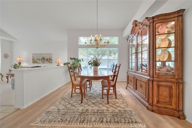 dining room featuring a notable chandelier and light wood finished floors