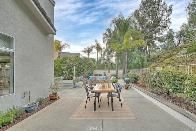 view of patio / terrace with an outdoor hangout area, outdoor dining area, and a fenced backyard