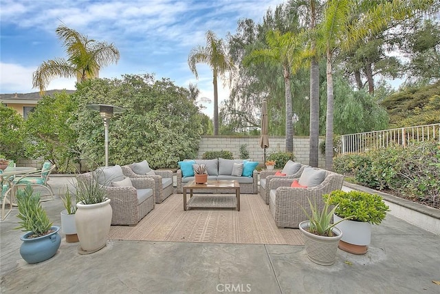 view of patio featuring an outdoor hangout area and a fenced backyard