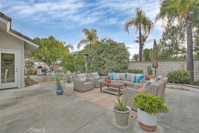 view of patio / terrace with an outdoor living space and fence