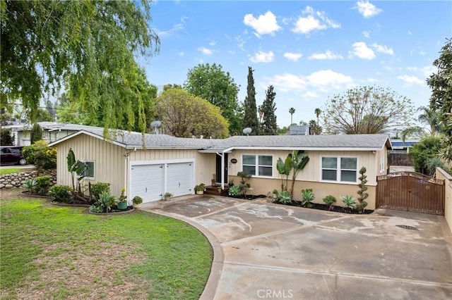 single story home featuring concrete driveway, a front yard, a chimney, a garage, and a gate