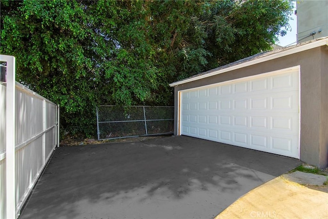 garage with fence
