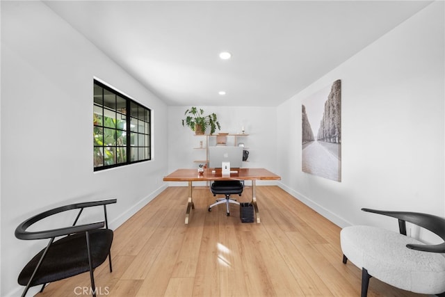 office area featuring light wood finished floors, recessed lighting, and baseboards