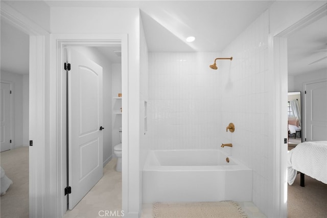 bathroom with ensuite bath, toilet, and washtub / shower combination