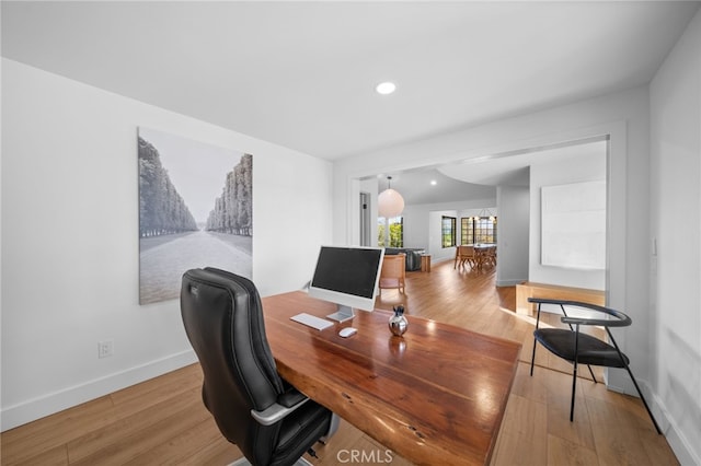 home office with recessed lighting, wood finished floors, and baseboards