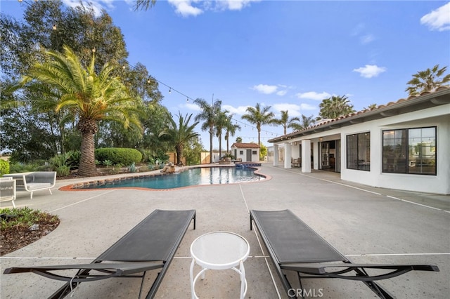 outdoor pool featuring a patio area