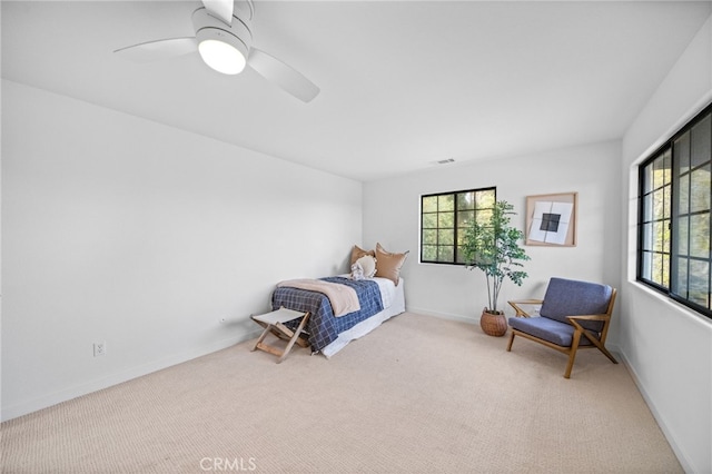 bedroom with baseboards, multiple windows, carpet, and a ceiling fan