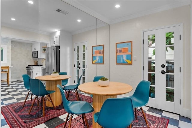 dining room featuring tile patterned floors, french doors, visible vents, and crown molding